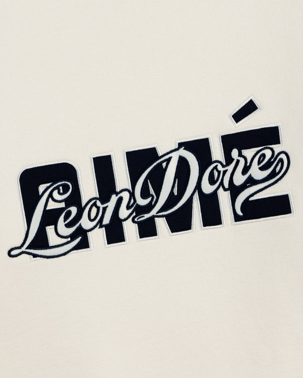 Cream-colored Overlay Logo Crewneck Sweatshirt with bold and cursive overlapping Aimé Leon Dore text in black and white.