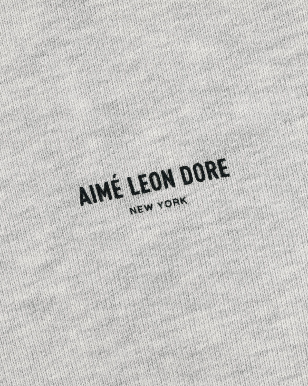 Safari Crewneck Sweatshirt in gray with centered black AIMÉ LEON DORE NEW YORK print. Minimalist design.