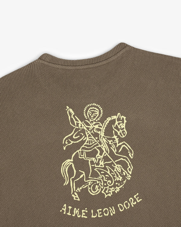 Brown piqué crewneck sweatshirt with embroidered Saint George slaying a dragon and AIMÉ LEON DORE text below.