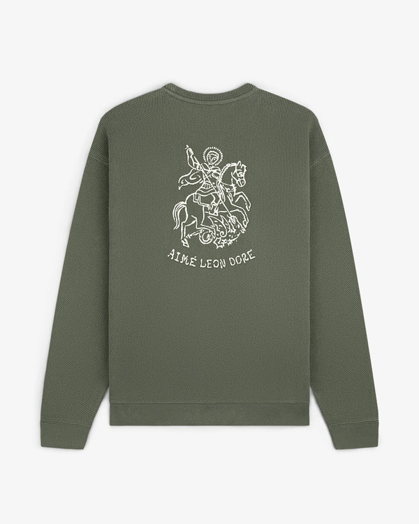 Olive green Saint George Piqué Crewneck Sweatshirt with saint on horse graphic and AIME LEON DORE text on back.
