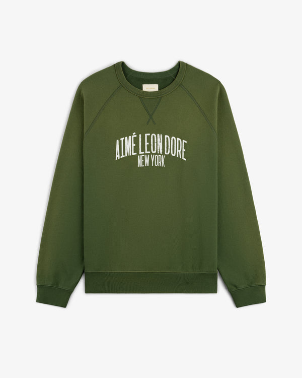 Vintage Washed Crewneck Sweatshirt in green with AIMÉ LEON DORE NEW YORK printed in white on the front.