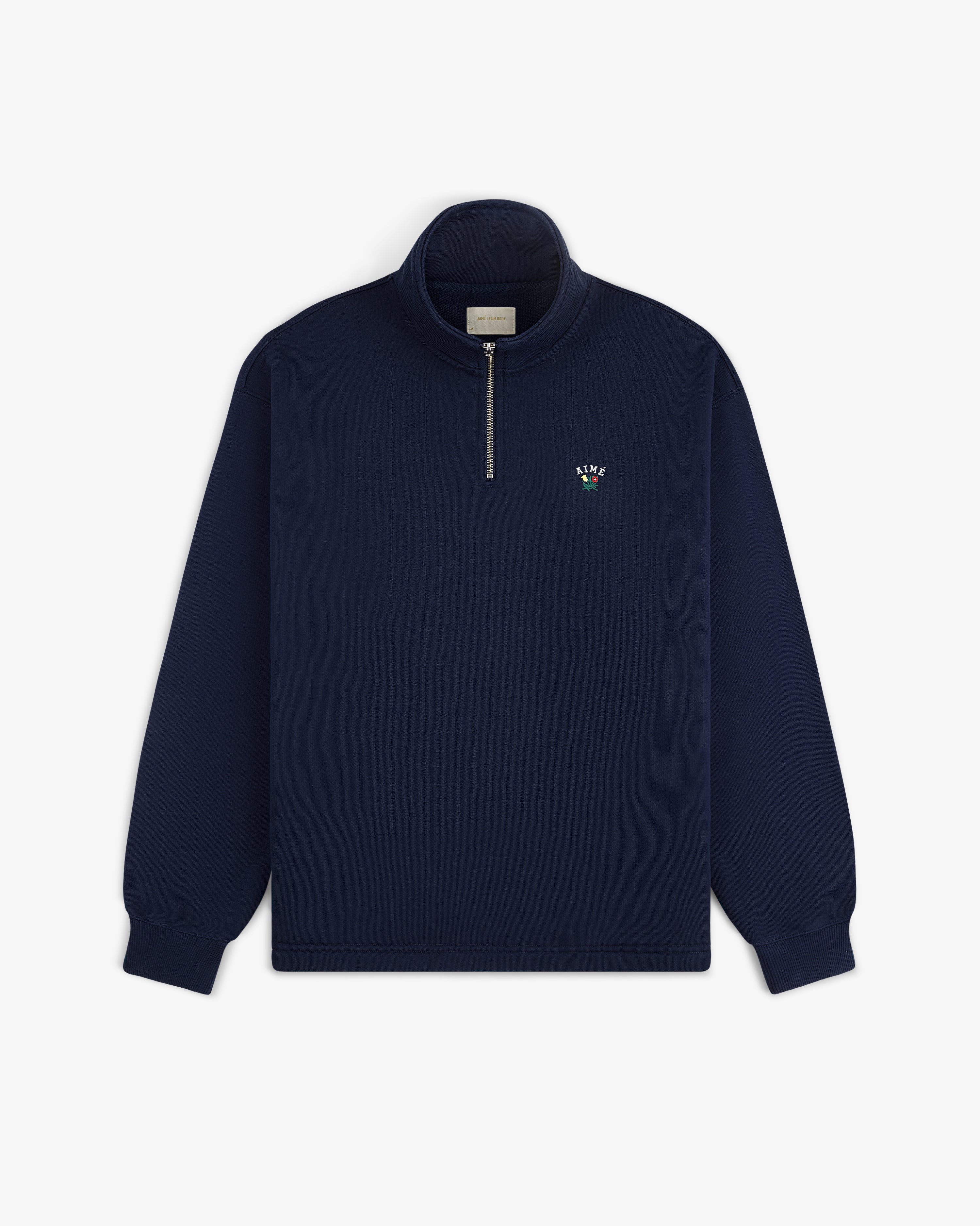Crest Quarter Zip Pullover in navy blue with long sleeves and a small embroidered logo on the left chest.