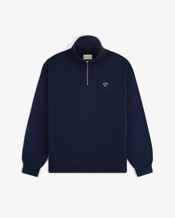 Crest Quarter Zip Pullover in navy blue with long sleeves and a small embroidered logo on the left chest.