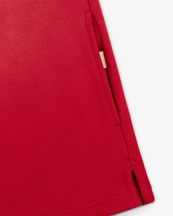 Close-up of the Sun Faded Crest Quarter Zip showing a side pocket, visible stitching, and a small hem slit on white.