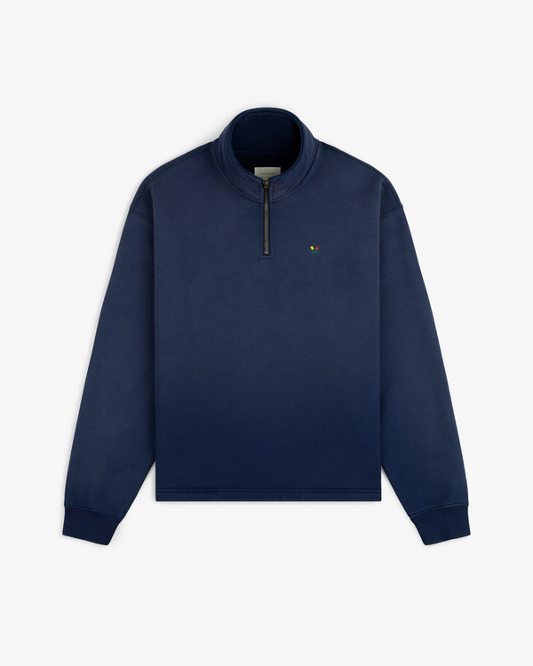 Sun Faded Crest Quarter Zip in navy with high collar and small embroidered logo on the left chest.