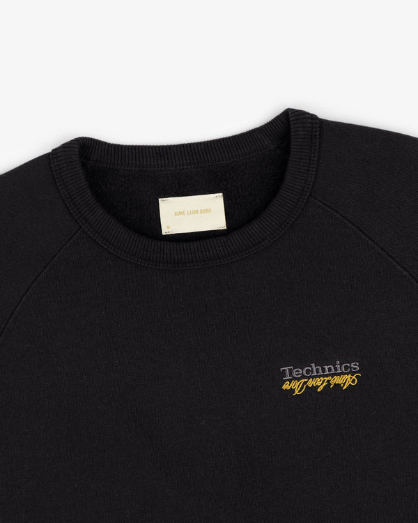 ALD / Technics World Champions Crewneck with "Technics" and "Sundays Are For Lovers" embroidered in yellow & white.