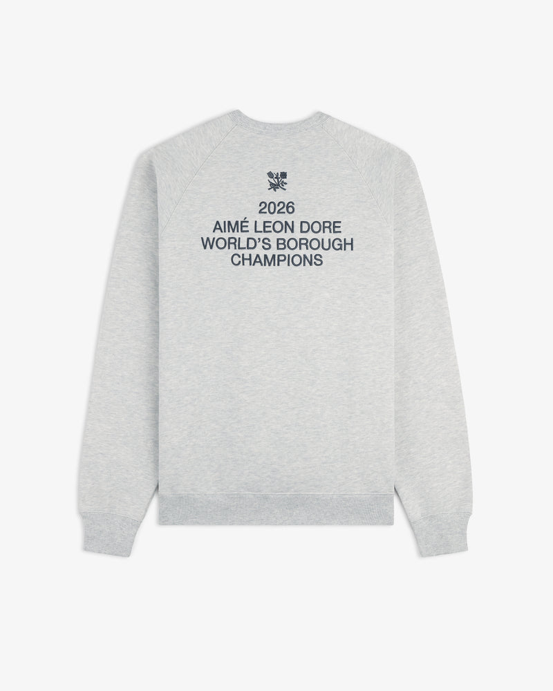 Light grey ALD / Technics World Champions Crewneck with "2026 Worlds Borough Champions" in navy blue on the back.