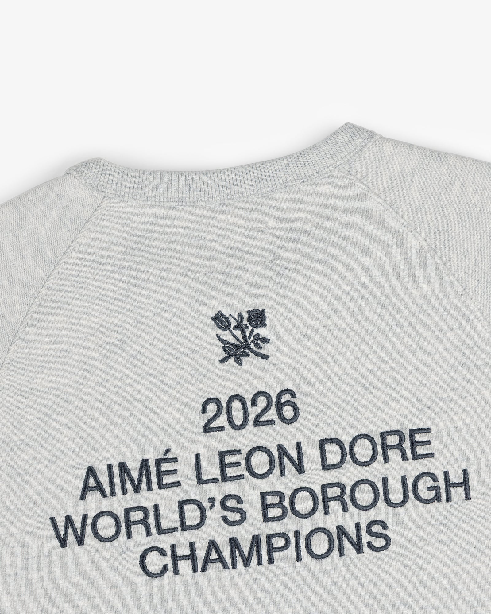 Light grey ALD / Technics World Champions Crewneck with “2026 AIMÉ LEON DORE WORLDS BOROUGH CHAMPIONS” and floral emblem.