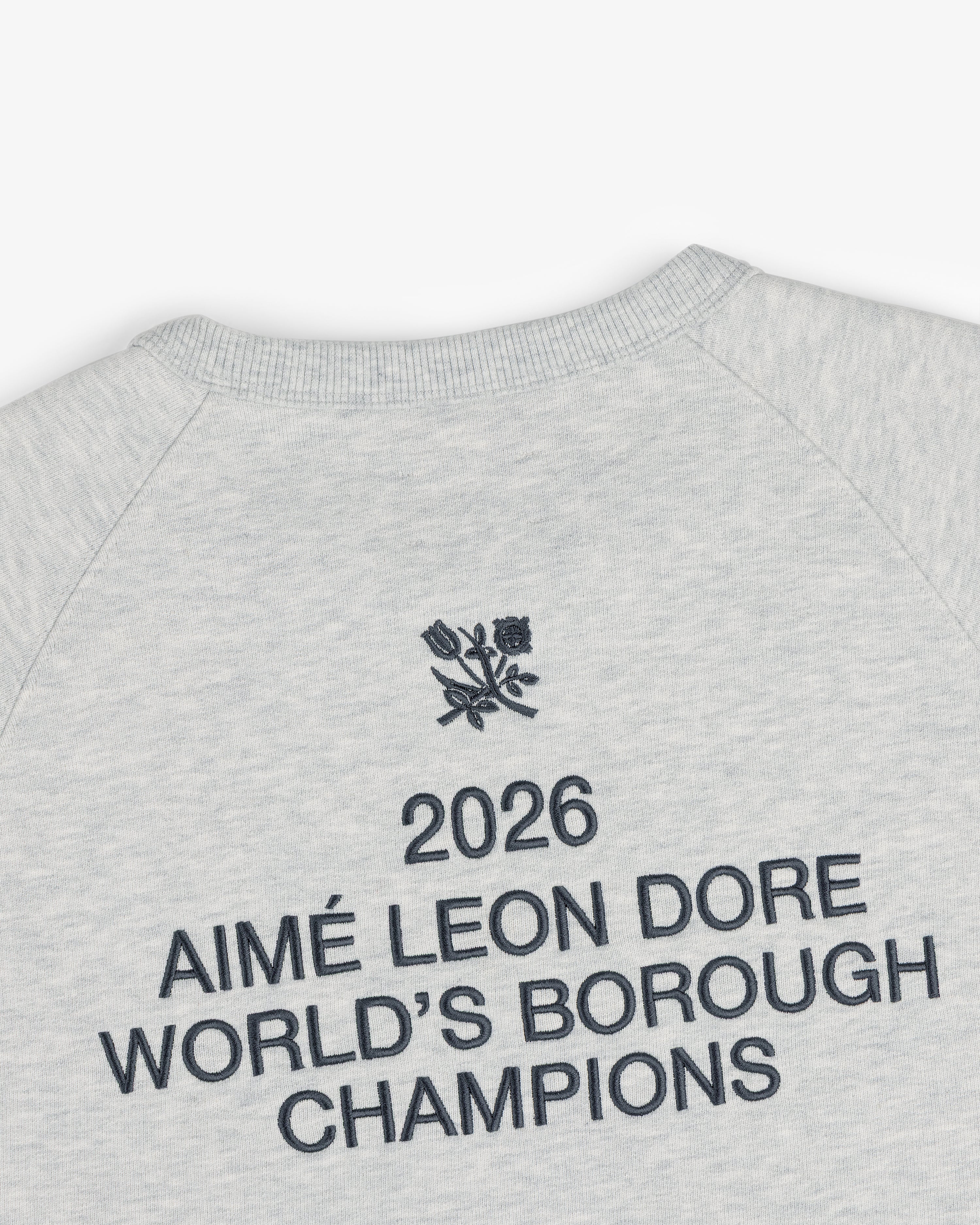 Light grey ALD / Technics World Champions Crewneck with “2026 AIMÉ LEON DORE WORLDS BOROUGH CHAMPIONS” and floral emblem.