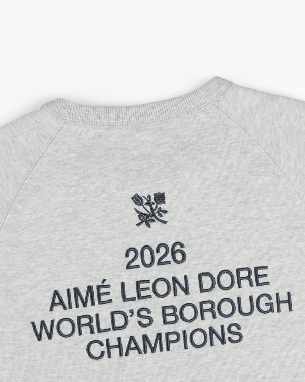 Light grey ALD / Technics World Champions Crewneck with “2026 AIMÉ LEON DORE WORLDS BOROUGH CHAMPIONS” and floral emblem.