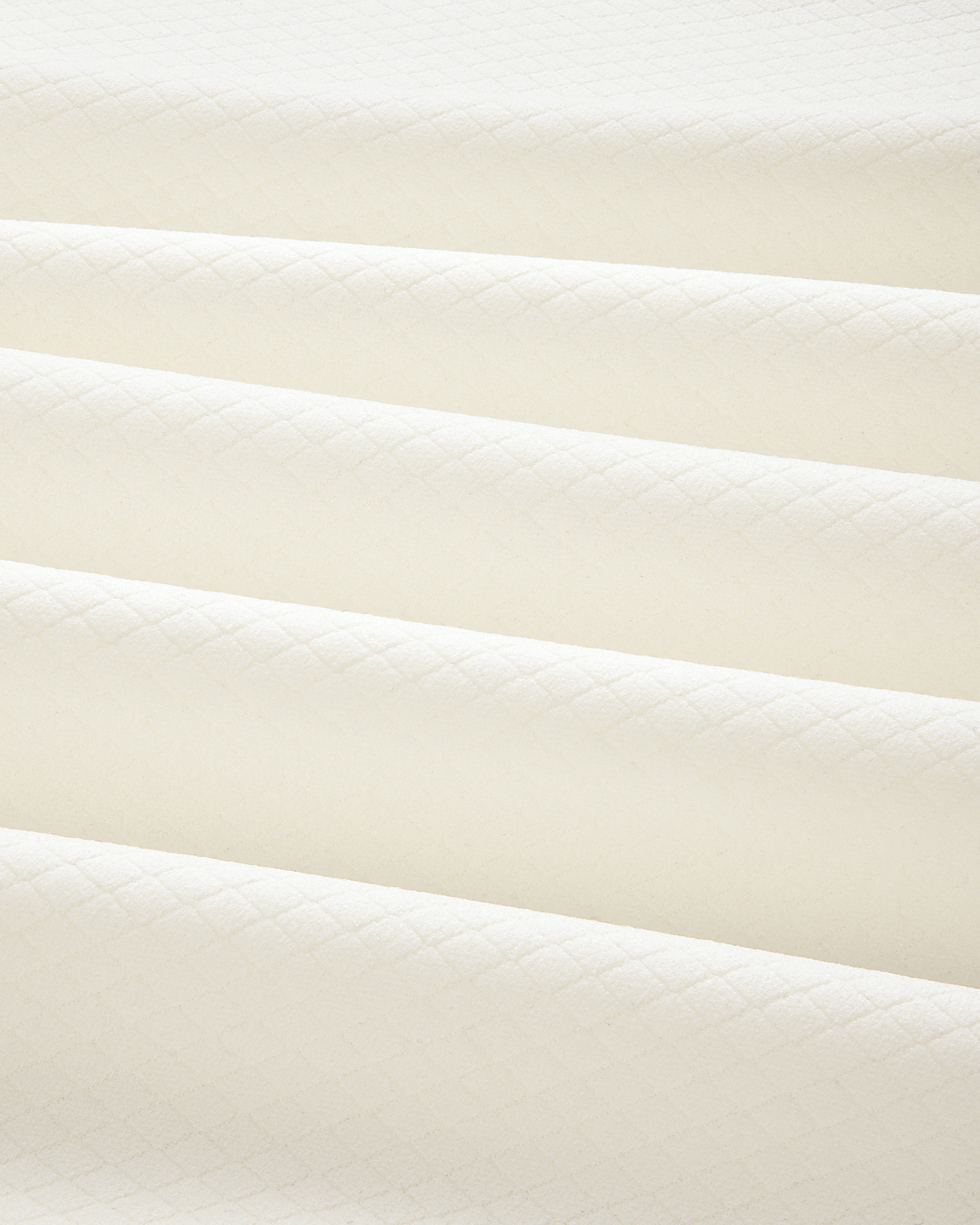 Cream-colored ALD Golf Quarter Zip Pullover in quilted fabric with a subtle diamond pattern and soft, even folds.