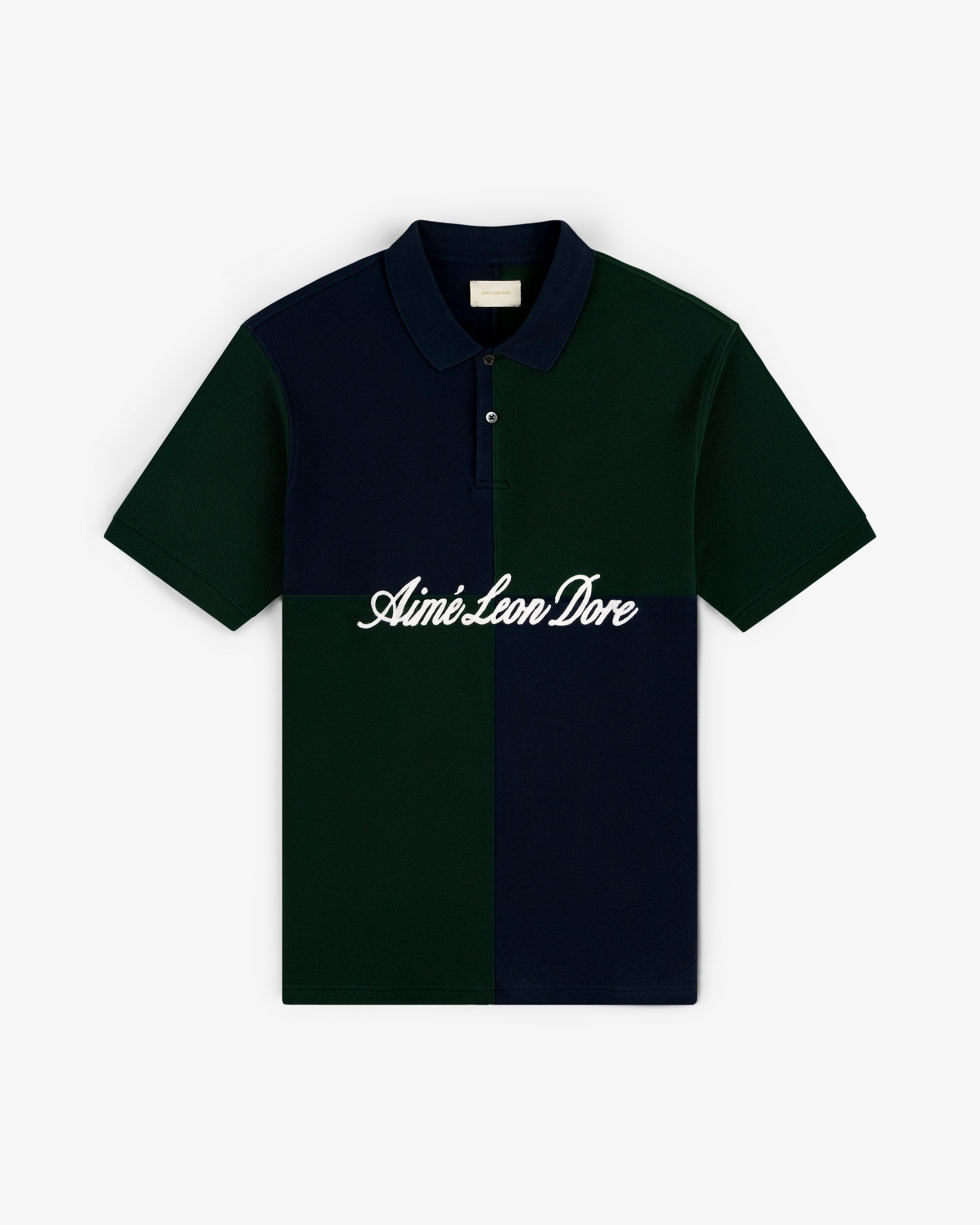 Color Blocked Pique Polo with dark green and navy panels plus Aimé Leon Dore script across the chest.