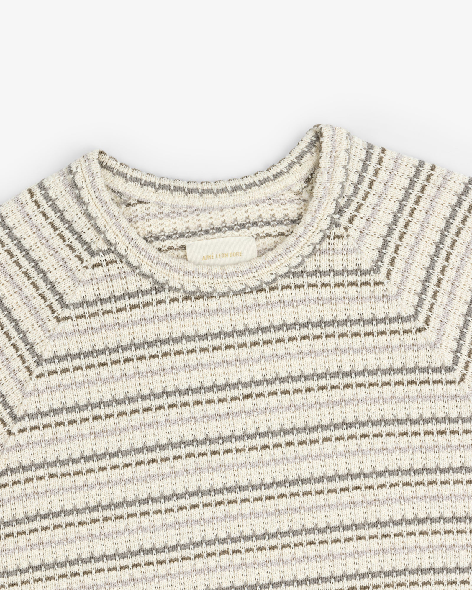 Jacquard Striped Tee in cream and gray with a ribbed crew neck, shown from the top front on a white background.