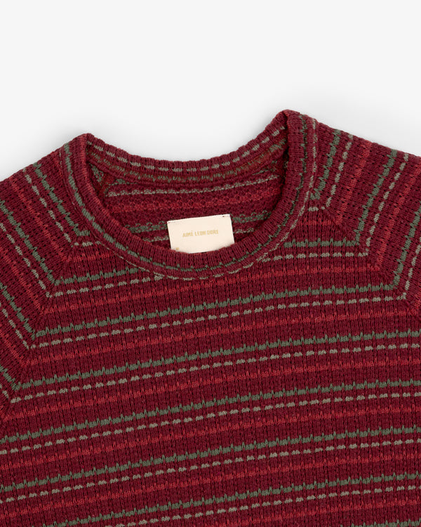 Jacquard Striped Tee in red and green ribbing with crew neck, displayed flat from the shoulders up.