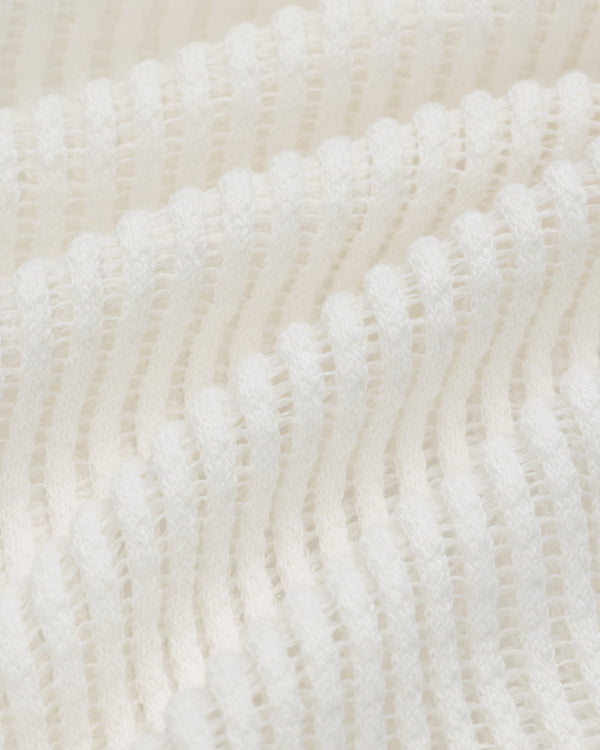 Close-up of Mesh V-Neck Tee in white, featuring ribbed knit texture with wavy horizontal ridges and soft material.
