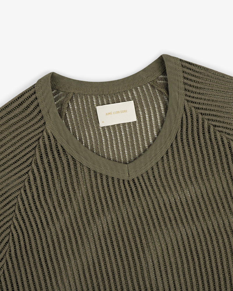 Olive green mesh V-neck tee featuring a visible woven label inside the collar.