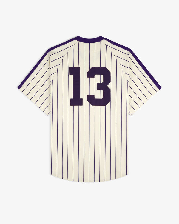 The Aimé Baseball Jersey features cream fabric, black pinstripes, and a bold black 13 on the back.