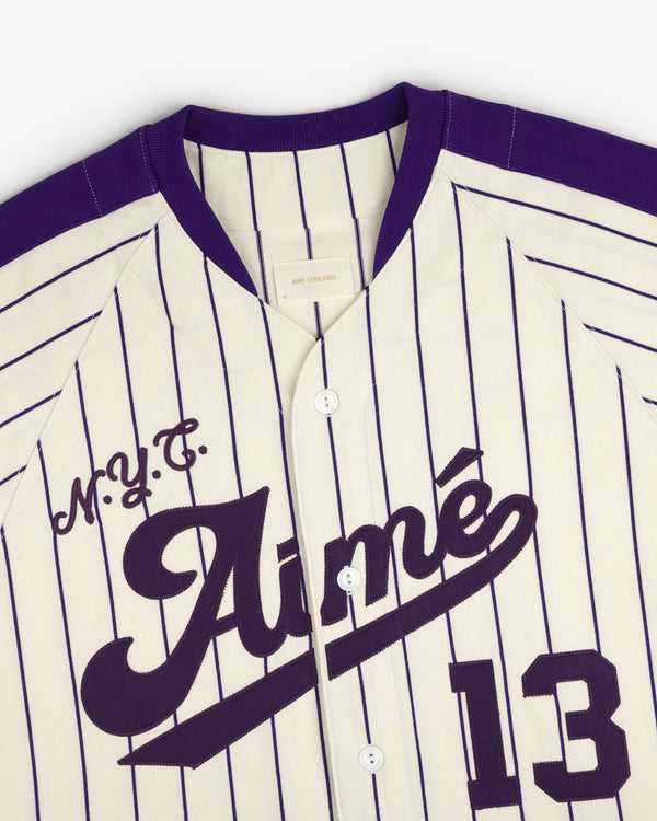 Aimé Baseball Jersey in white with purple pinstripes, Aimé, M.Y.C., and the number 13 on the front.