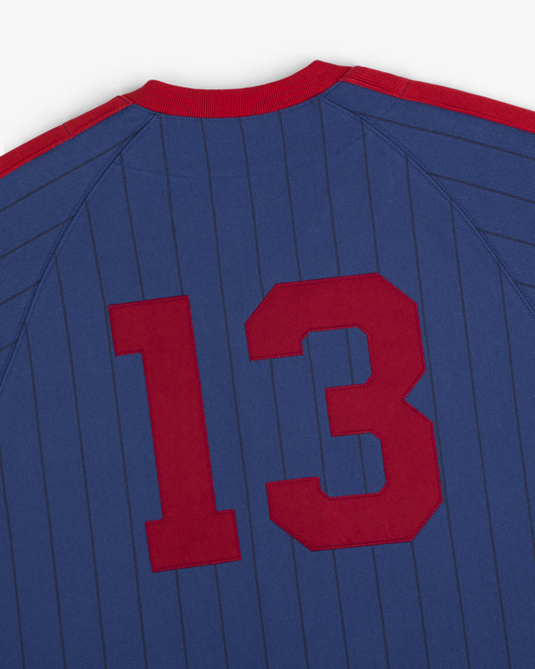 Aimé Baseball Jersey: blue with thin vertical stripes, large red number 13 on the back.