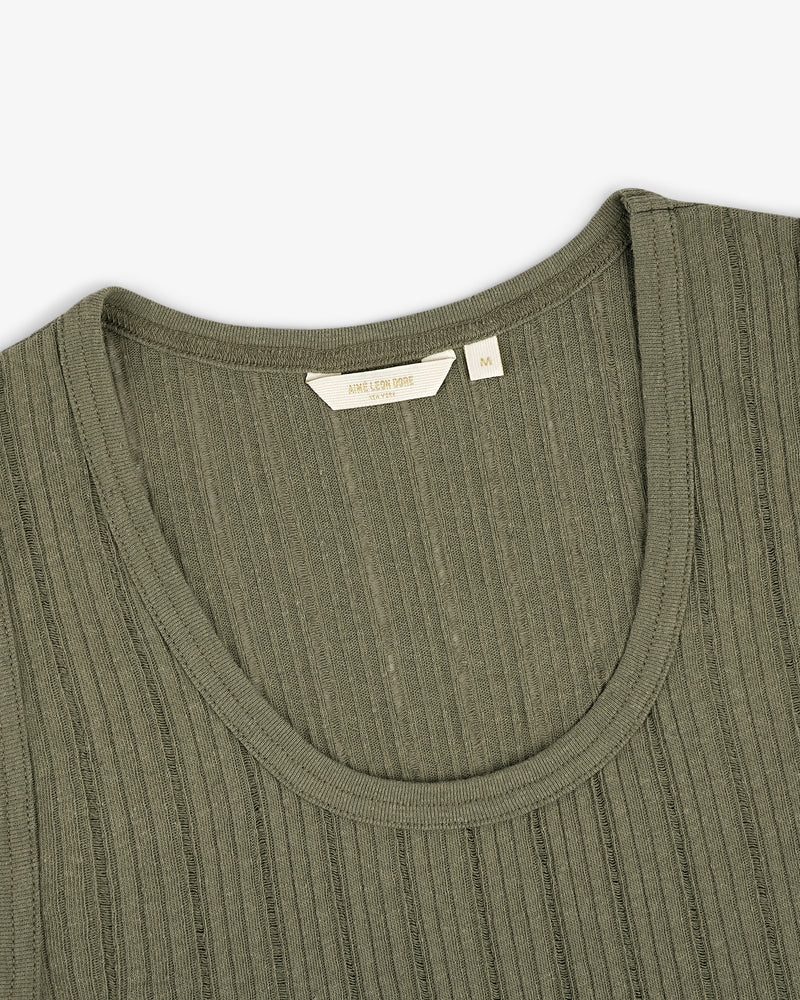 Close-up of the Drop Needle Tank Top in olive green with ribbed knit, round neckline, and visible size tag.