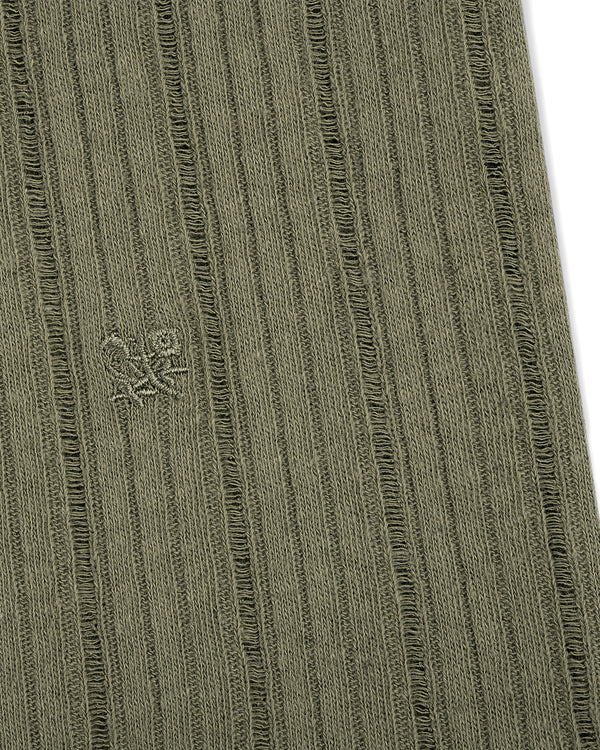 Close-up of olive green Drop Needle Tank Top's ribbed fabric with a small embroidered logo of two abstract shapes.