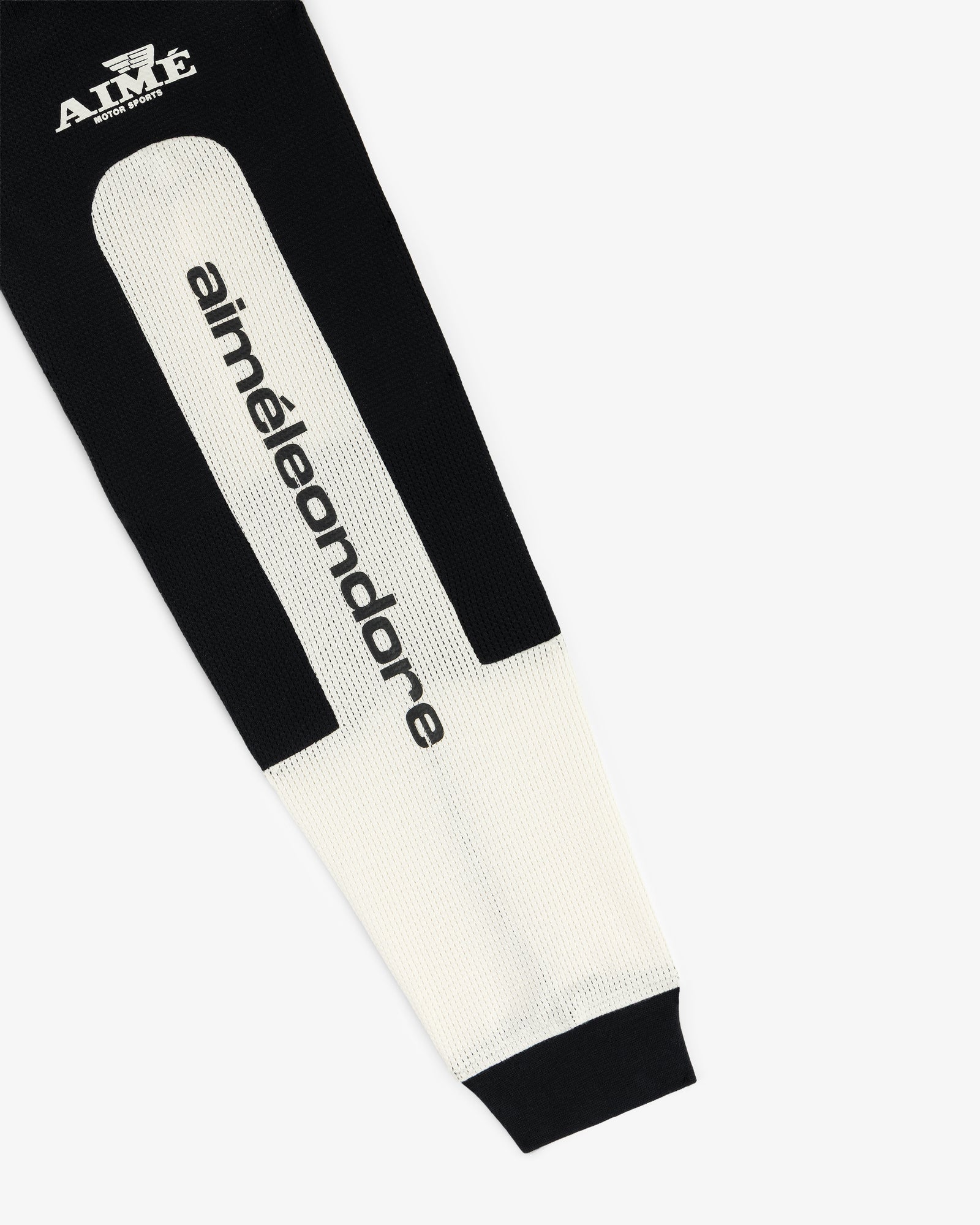 The Long-Sleeve Mesh Enduro Tee features black and white sleeves with aiméleondore text and an AIMÉ logo near the cuff.