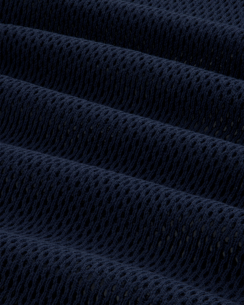 Close-up of dark blue Mesh Tank Top showing textured mesh fabric with small holes and horizontal folds.