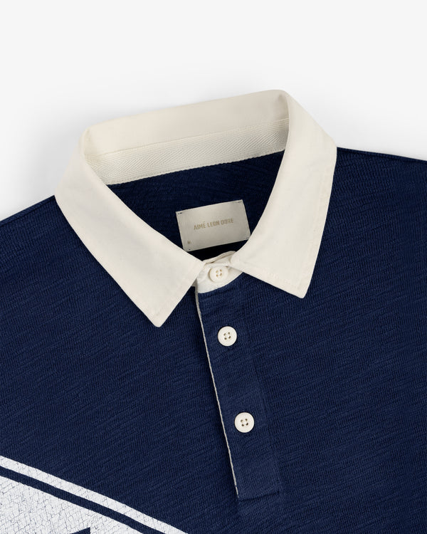 Vintage Slub Rugby polo in navy with white buttons and contrasting collar, displayed flat on a white background.