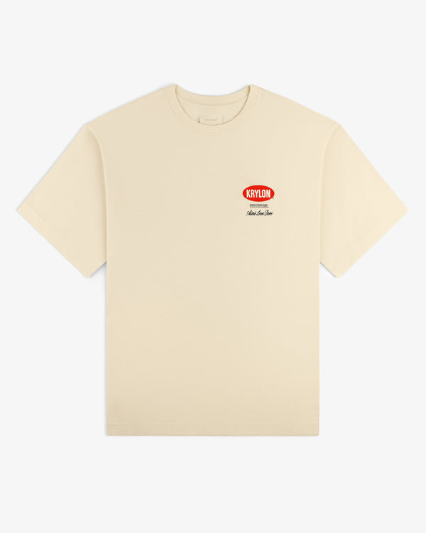 Krylon Logo Tee in cream with a small red KRYLON logo and black text on the left chest.