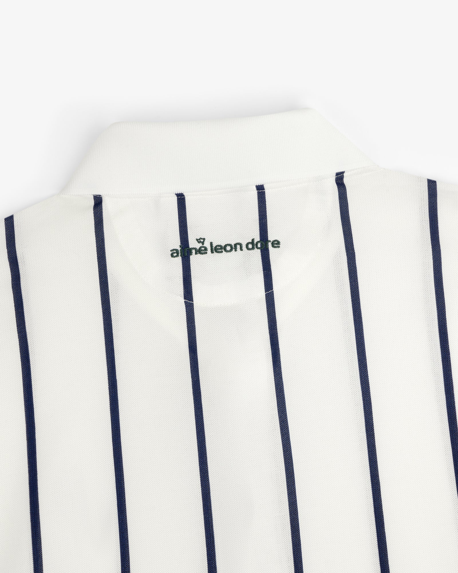 ALD Golf Polo: White collared shirt with vertical navy stripes and green logo inside the collar.