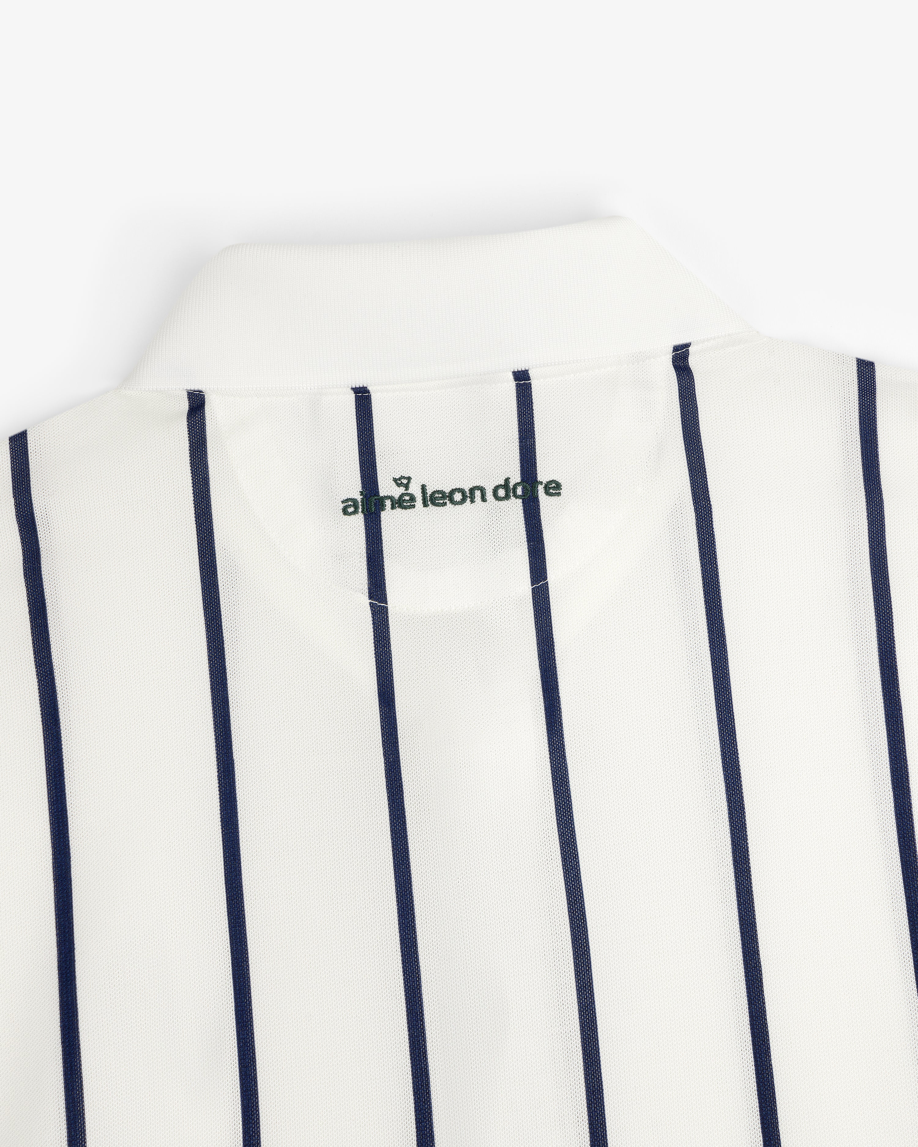 ALD Golf Polo: White collared shirt with vertical navy stripes and green logo inside the collar.