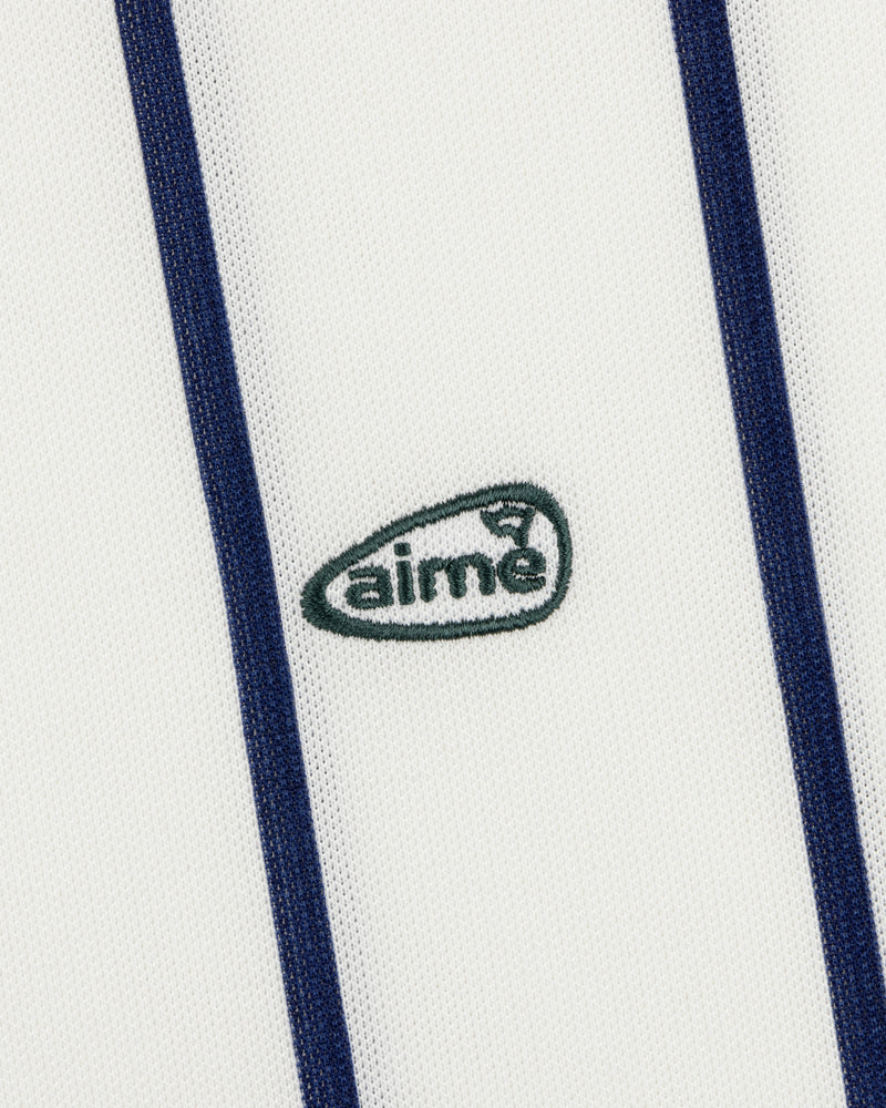 The ALD Golf Polo features white fabric with vertical navy stripes and a small green aimé logo embroidered at the center.