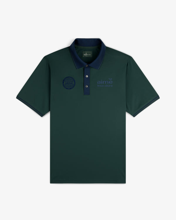 ALD Golf Tour Polo: Dark green with navy collar, 3 buttons, blue embroidered logos on both chests.