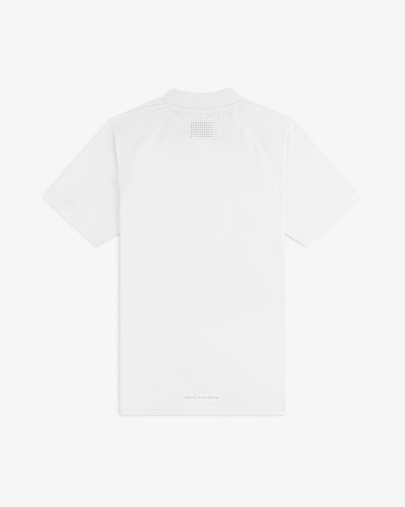 Back of the ALD Golf Performance Tee: plain white, mesh on upper shoulders, subtle text near the hem.