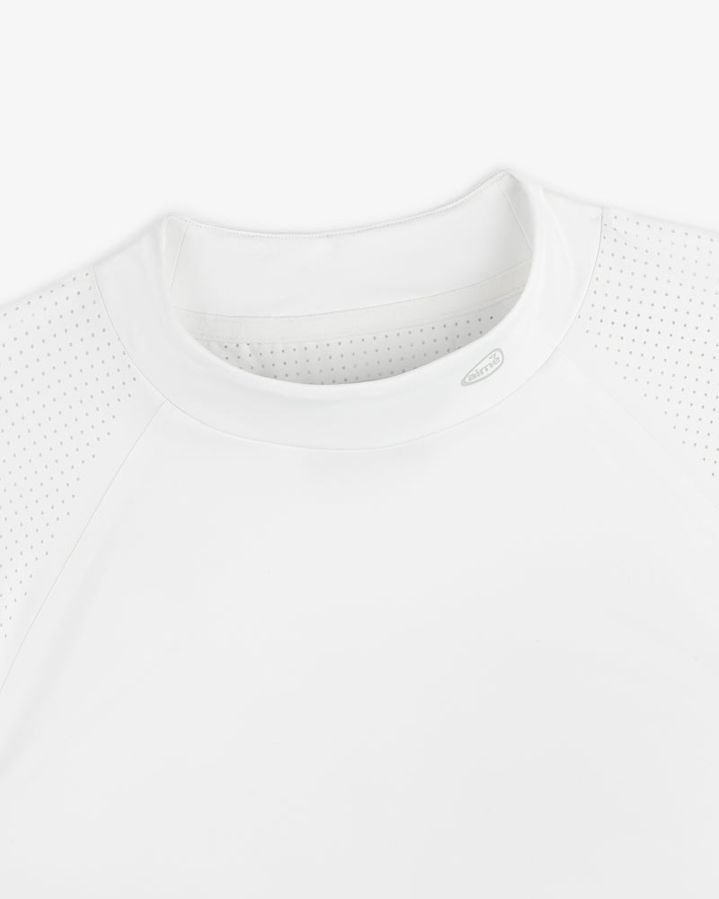 Close-up of the ALD Golf Performance Tee, featuring perforated raglan sleeves and a crew neck on a white background.