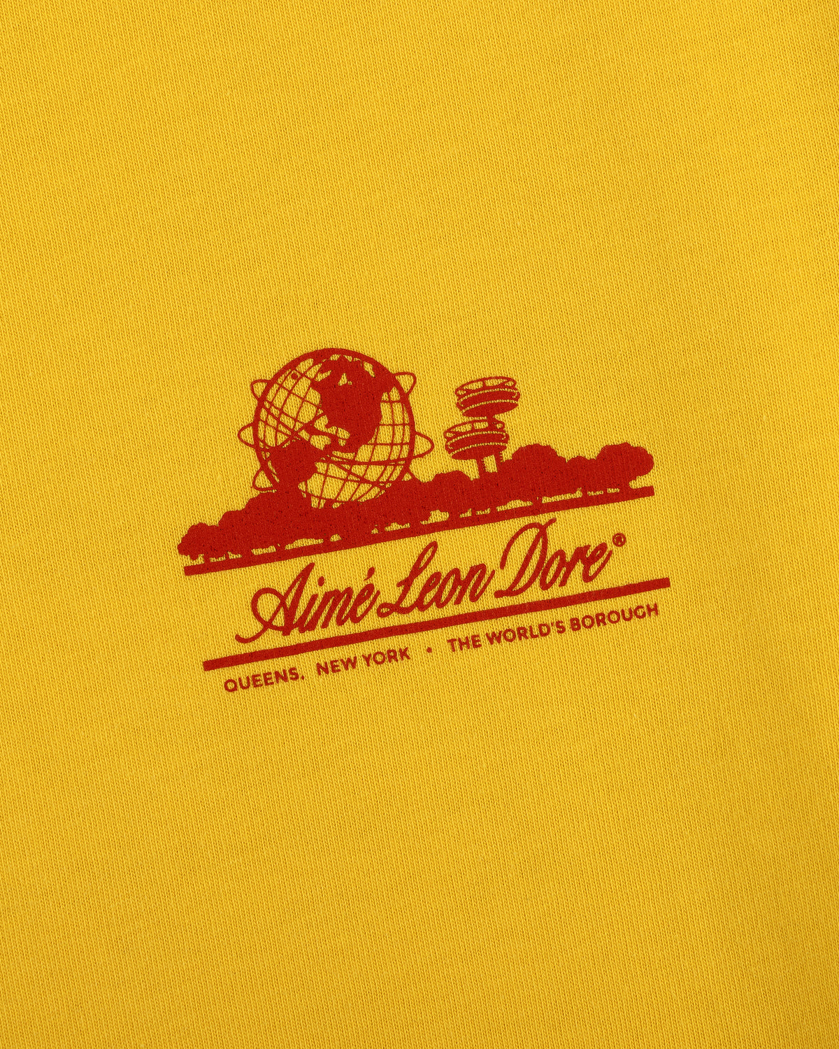 Sun Faded Unisphere Tee featuring a red Aimé Leon Dore logo with globe and "Queens, New York - The Worlds Borough" text.