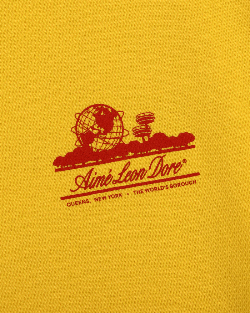Sun Faded Unisphere Tee featuring a red Aimé Leon Dore logo with globe and "Queens, New York - The Worlds Borough" text.