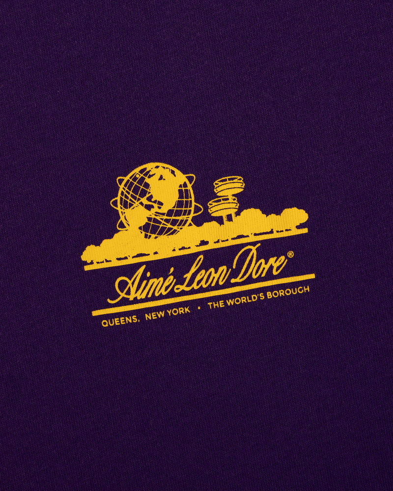 Sun Faded Unisphere Tee: Yellow Unisphere graphic and Aimé Leon Dore text on purple with Queens, NY below.