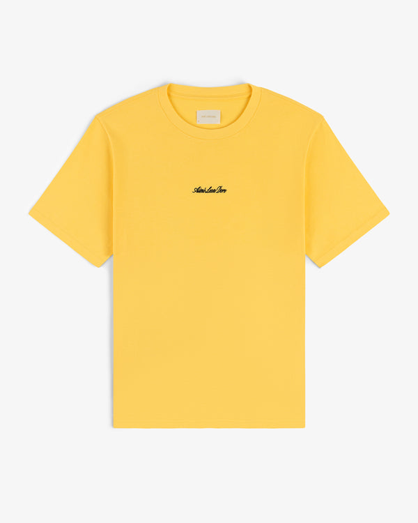 Embroidered Logo Tee in yellow with small black chest embroidery, shown on a white background.
