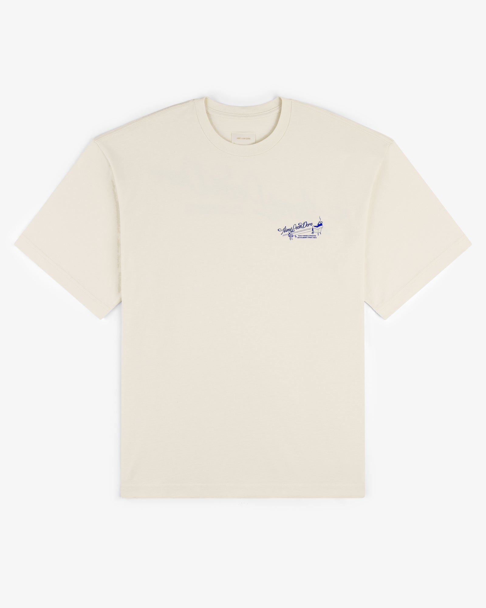 Pappoús Logo Tee: Off-white short-sleeve shirt with small blue script and airplane graphic on left chest.
