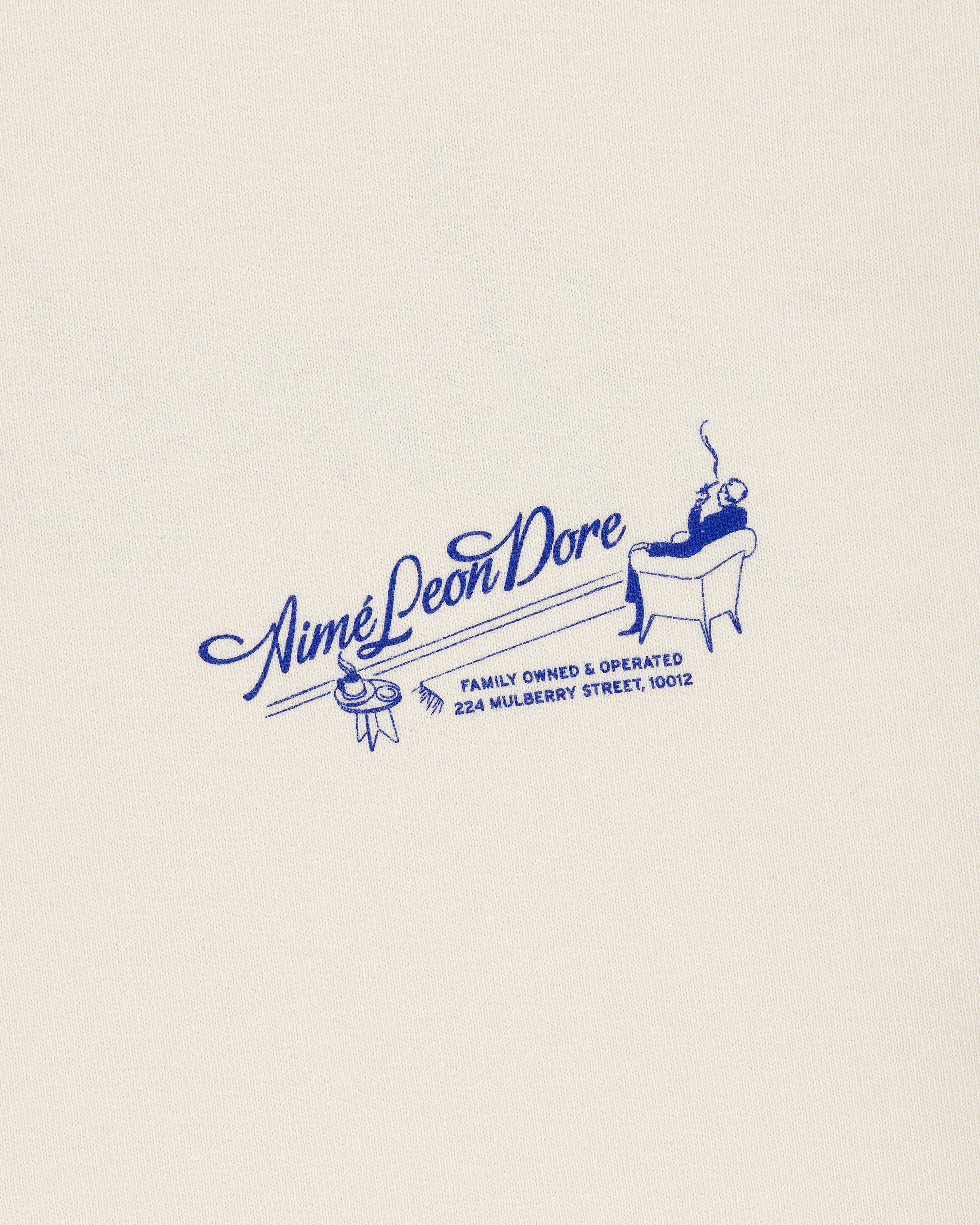 Cream Pappoús Logo Tee with blue Aimé Leon Dore logo, man illustration, and 224 Mulberry Street address.