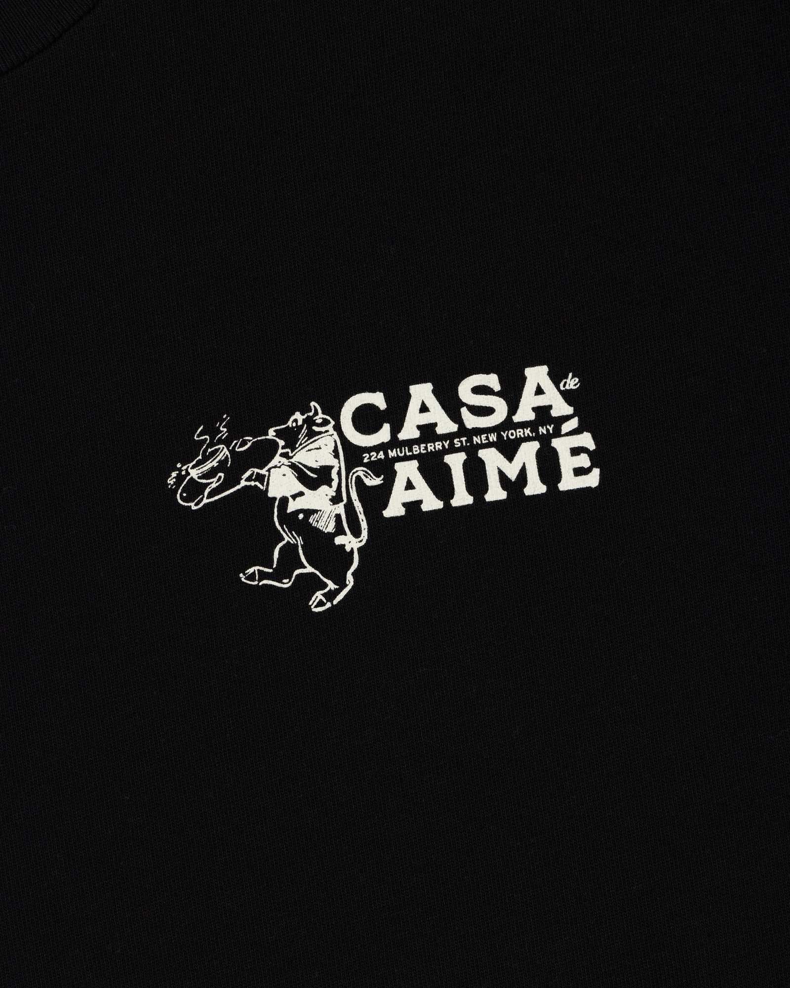 Long-Sleeve Casa Tee: Black shirt with white dancing bull graphic, flower, and CASA de AIME, 224 Mulberry St. NY text.