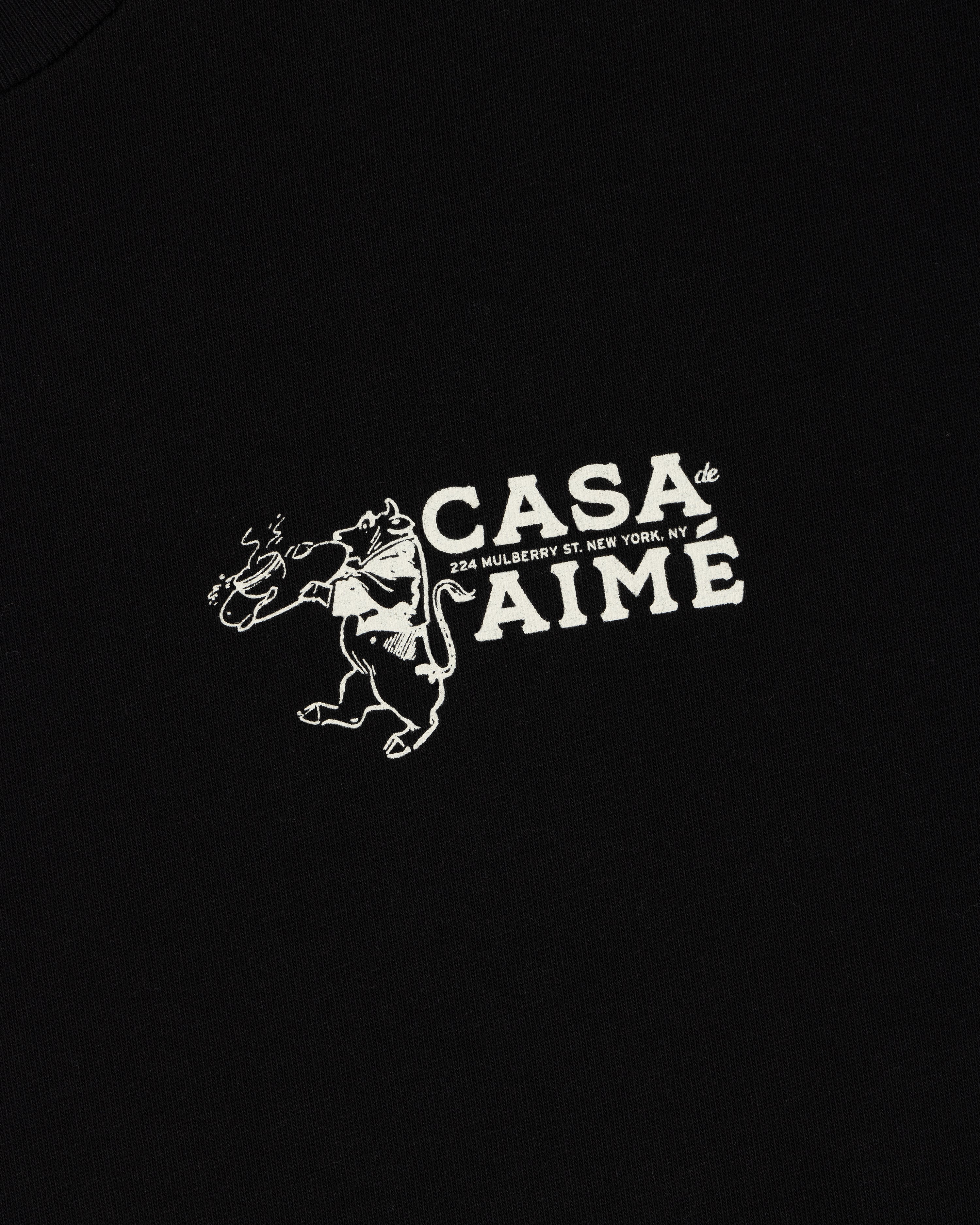 Long-Sleeve Casa Tee: Black shirt with white dancing bull graphic, flower, and CASA de AIME, 224 Mulberry St. NY text.