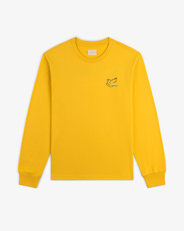 Long-Sleeve Souvenir Tee in yellow with a small embroidered bird logo on the left chest, laid flat on white.