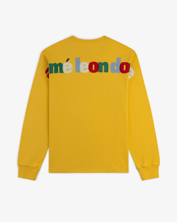 Yellow Long-Sleeve Souvenir Tee with colorful overlapping "méléondo" lettering across the upper back.
