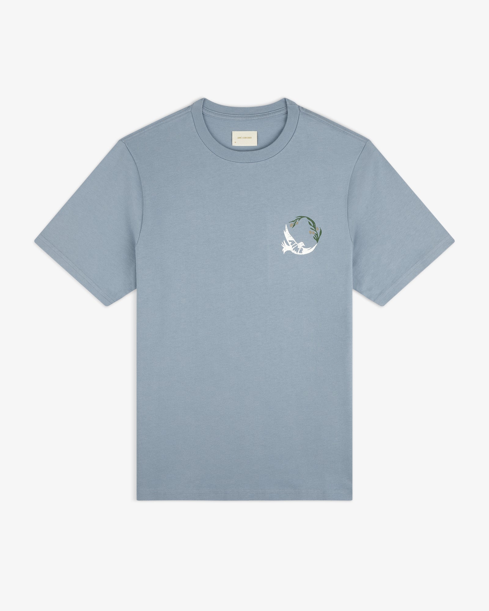 Woodblock Dove Tee: light blue short-sleeve featuring a small white bird and green leaves on the left chest.