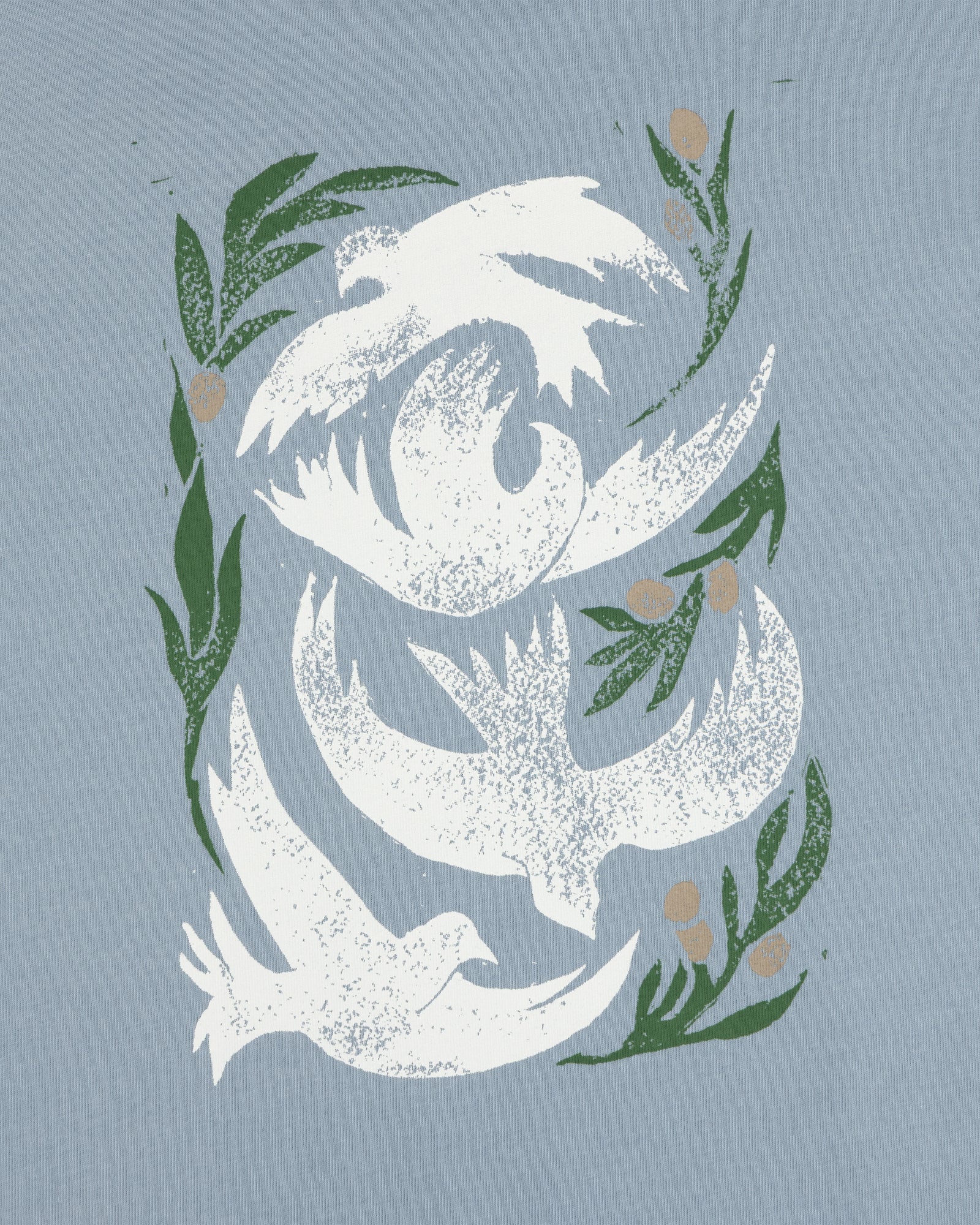 Three white doves soar among leaves and berries on a light blue Woodblock Dove Tee.