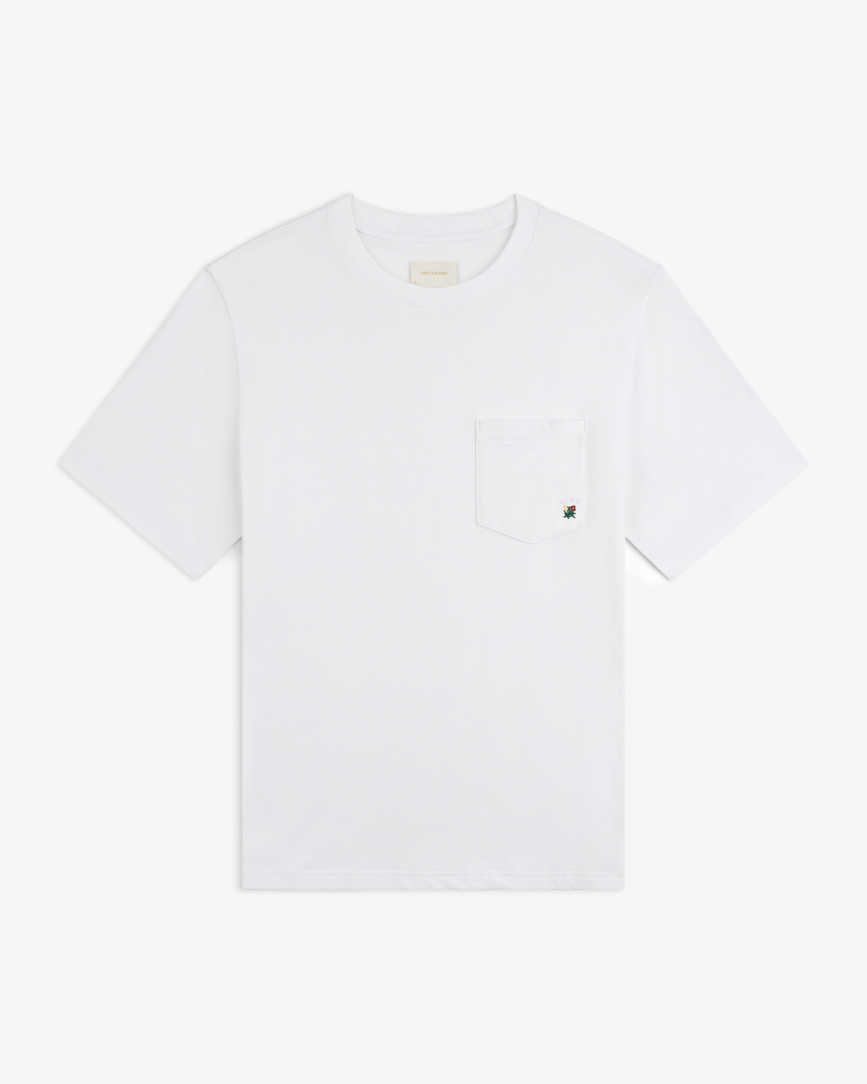 Crest Pocket Tee: White short-sleeve shirt with chest pocket and subtle embroidered detail.
