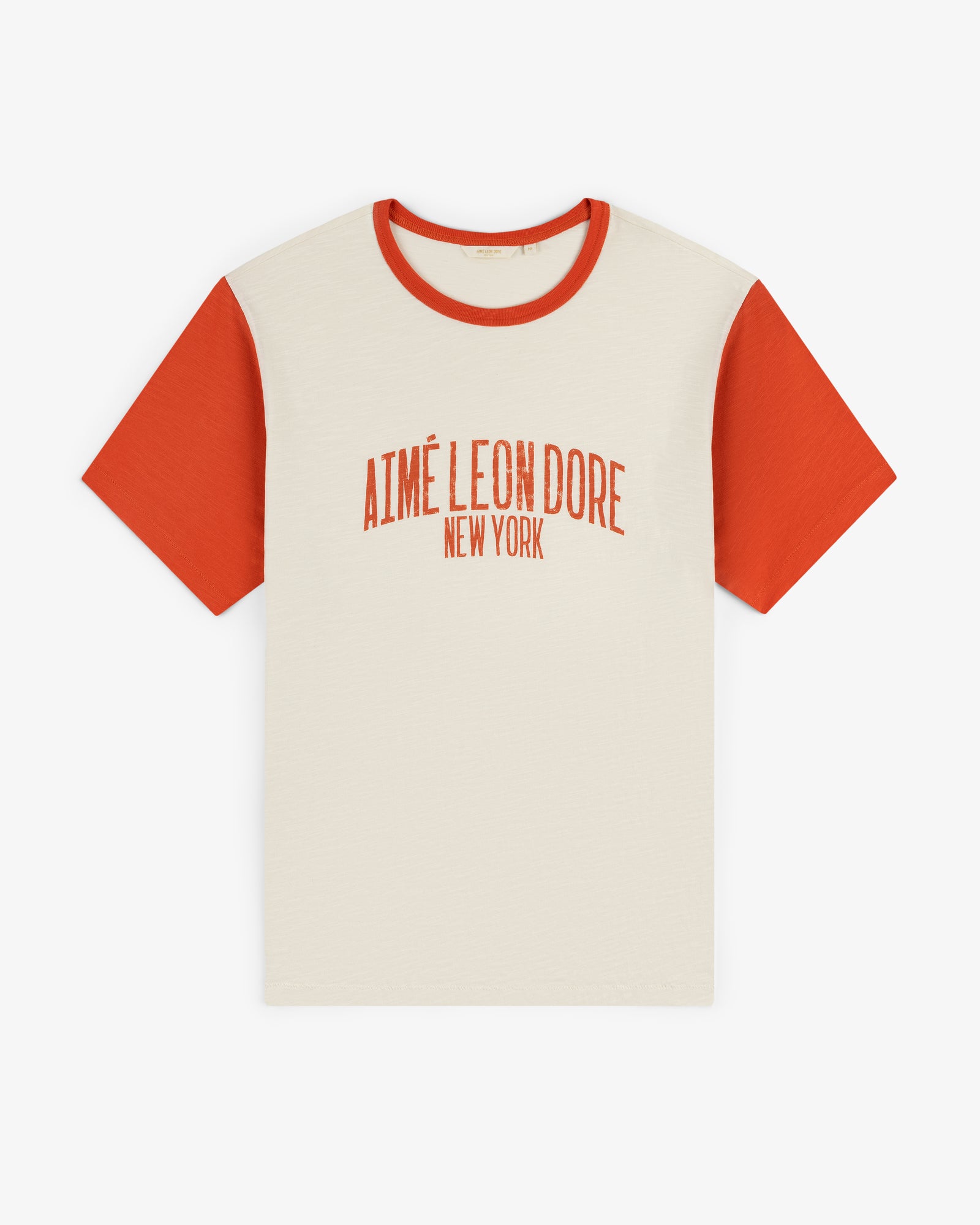 Washed Ringer Tee: cream with red sleeves, Aimé Leon Dore New York printed in red on the front.