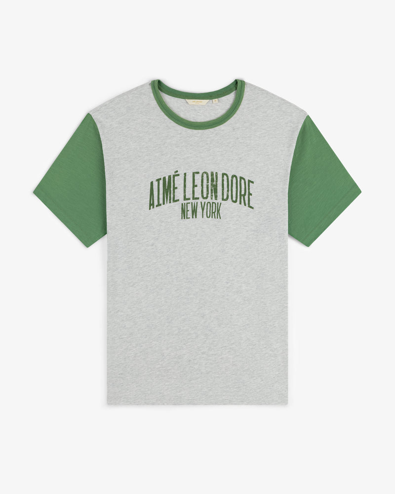 Washed Ringer Tee in gray with green sleeves and AIMÉ LEON DORE NEW YORK printed in green on the front.
